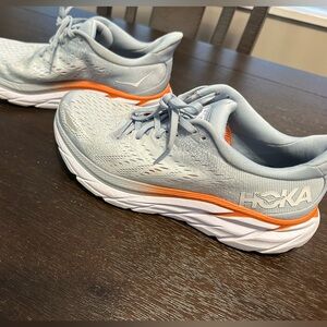 Hoka Light Gray and Orange Athletic Shoes